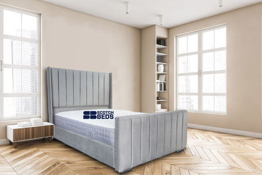 Wooden bedroom and canvas over bed with linens, beige walls and