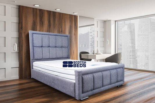 White and wooden loft bedroom corner with armchair